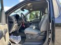 2022 Ford F-350 SD interior with a gray seat and steering wheel visible showing dashboard controls and floor mats