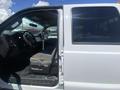 A 2016 Ford F-350 SD with an open door revealing the interior featuring a driver's seat and dashboard