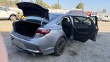 A 2018 Hyundai Sonata with its trunk open and rear doors ajar showcasing an interior view of the vehicle
