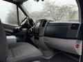 Interior view of a 2017 Mercedes-Benz Sprinter showing the dashboard with controls and a driver's seat