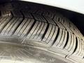 Close-up of a tire from a 2020 Ford Transit Connect showing detailed tread pattern and sidewall markings
