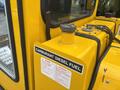 A close-up of a yellow Bombardier SW48 machine showing a fuel tank with a metal cap and a label indicating it is for diesel fuel