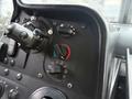 Dashboard controls of a 2018 Ford E-450 featuring knobs for temperature settings air conditioning and ventilation adjustments