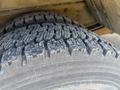 Close-up of a worn tire from a 2009 Workhorse W62 showing visible tread patterns and textured surface