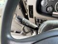 A close-up view of the steering column controls in a 2015 Peterbilt 337 showing turn signal and wiper controls
