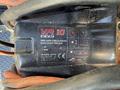 A close-up of a black winch labeled VR 10 EVO displaying load limits and safety instructions
