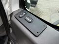 Control panel featuring lock and auto window buttons for a 2012 International TerraStar