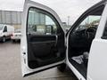 A 2013 Chevrolet Silverado 3500HD with the driver's door open showcasing the interior and dashboard details