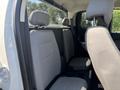 Interior seats of a 2017 Chevrolet Colorado showing two front seats and headrests upholstered in light gray fabric