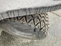 A 2010 Kubota RTV 900 with a close-up view of its rugged tire showcasing a distinct tread pattern