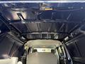 Interior view of a 2011 Ford Econoline showcasing a dark ceiling and a single gray seat in the foreground