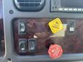 Control panel of a 2022 Freightliner M2 106 featuring buttons for heating parking and trailer brakes with red and yellow knobs