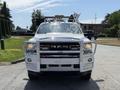 A 2020 Ram 2500 with a shiny front grille featuring the RAM logo and a protective bull bar mounted on the front. The vehicle is equipped with emergency lights on the roof.