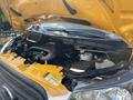 A 2018 Ford Transit-350 with its hood raised showing the engine compartment and various components including hoses and fluid reservoirs