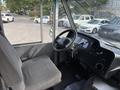 Interior view of a 2018 Ford Econoline showing the driver's seat steering wheel and dashboard controls