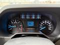 Dashboard of a 2024 Ford E-450 showing speedometer fuel gauge and digital display with various indicators and controls