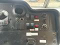 Dashboard of a 2012 Ford E-450 Super Duty featuring various switches knobs and indicators