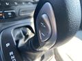 Close-up of the gear shift lever of a 2016 Ford Escape showing the gear selection buttons and leather-wrapped handle