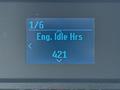 A digital display screen showing information about a 2023 Ford E-450 with the title 'Eng. Idle Hrs' and a value of 421 hours