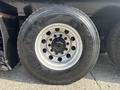 Close-up of a Good Year Ultra Grip tire mounted on a 2013 International WorkStar with visible wheel rim and lug nut details