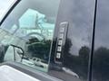 Close-up of the door keypad on a 2017 Ford F-150 showing five numeric buttons for keyless entry