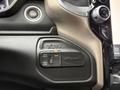 Close-up of the control panel in a 2024 RAM 5500 featuring buttons for 4WD high, 4WD low, and 2WD along with a heavy-duty label