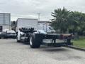 A white 2020 Lion Lion6 truck chassis with no cabin visible is parked, showing the rear view and frame with tires and attached components