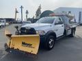 A white 2016 RAM 5500 truck with a yellow Meyer snow plow attached at the front