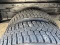 Close-up of a treaded tire from a 2012 Ford Econoline showing detailed patterns and wear on the rubber surface