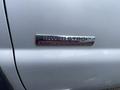 Close-up of a badge on a silver 2007 Ford F-350 SD reading Power Stroke Turbo Diesel