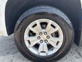 Close-up of a silver alloy wheel with six spokes and a black tire marked with BFGoodrich on a 2017 Chevrolet Colorado