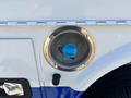 Fuel cap of a 2017 Chevrolet Colorado with a blue cap visible in the center of a circular metal housing