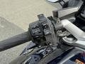 Close-up of the right handlebar controls of a 2016 Yamaha FJR1300AE motorcycle featuring buttons for cruise control and headlight functions