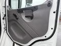 The interior door panel of a 2019 Freightliner M2 featuring a gray color with a smooth surface and a handle for opening, along with a knob for adjusting the window