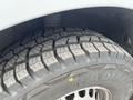 Close-up of a tire from a 2025 Mercedes-Benz Sprinter showing a rugged tread pattern designed for traction and stability