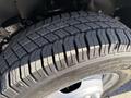 Close-up of a tire from a 2019 Chevrolet Express showcasing its tread pattern and wheel rim