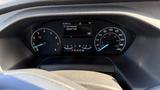 Dashboard display of a 2021 Ford Transit with speedometer fuel gauge and warning lights showing tire pressure monitor fault