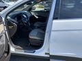 Interior of a 2018 Hyundai Santa Fe showing the driver's seat steering wheel and dashboard