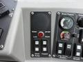 Control panel featuring buttons and gauges for a 2012 Global M4 including water level indicator and brooms control elements