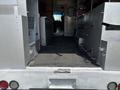 Interior view of a 2011 Workhorse W62 showing an empty cargo area with metallic surfaces and rubber flooring