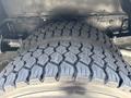 Close-up of a tire on a 2011 Workhorse W62 showing a textured tread pattern designed for traction and durability