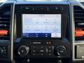 Dashboard of a 2020 Ford F-350 showcasing a touchscreen display with menu options including phone Bluetooth audio and settings controls