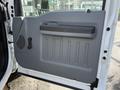 The interior door panel of a 2011 Ford F-250 SD featuring a gray design with a handle and speaker vent