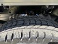 Close-up of a rugged tire on a 2019 Ford F-150 showcasing deep treads designed for off-road traction