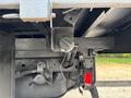 Close-up view of the undercarriage of a 2016 RAM 5500 showing various components including a hitch and wiring elements