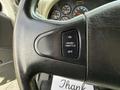 Close up of the steering wheel of a 2014 International TerraStar showing the cruise throttle control with buttons for on and off