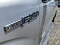 A close-up view of a 2014 Ford F-150 badge with the FX4 designation visible on the side of the truck