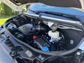 The engine compartment of a 2024 Mercedes-Benz Sprinter 2500 featuring various mechanical components including the air intake and fluid reservoirs