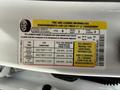 Tire and loading information label on a 2021 Ford F-150 detailing seating capacity and recommended tire pressures