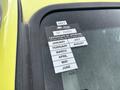 2010 Ford F-550 Super Duty with a bright yellow exterior and a certificate of approval sticker on the windshield